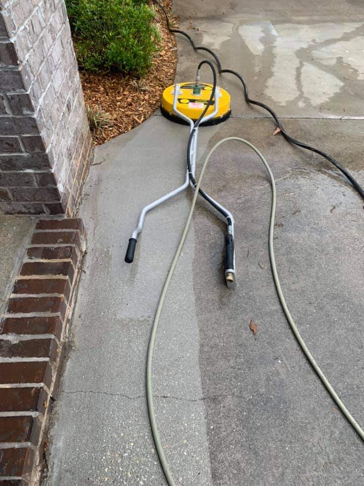 concrete before and after cleaning with yellow pressure washer